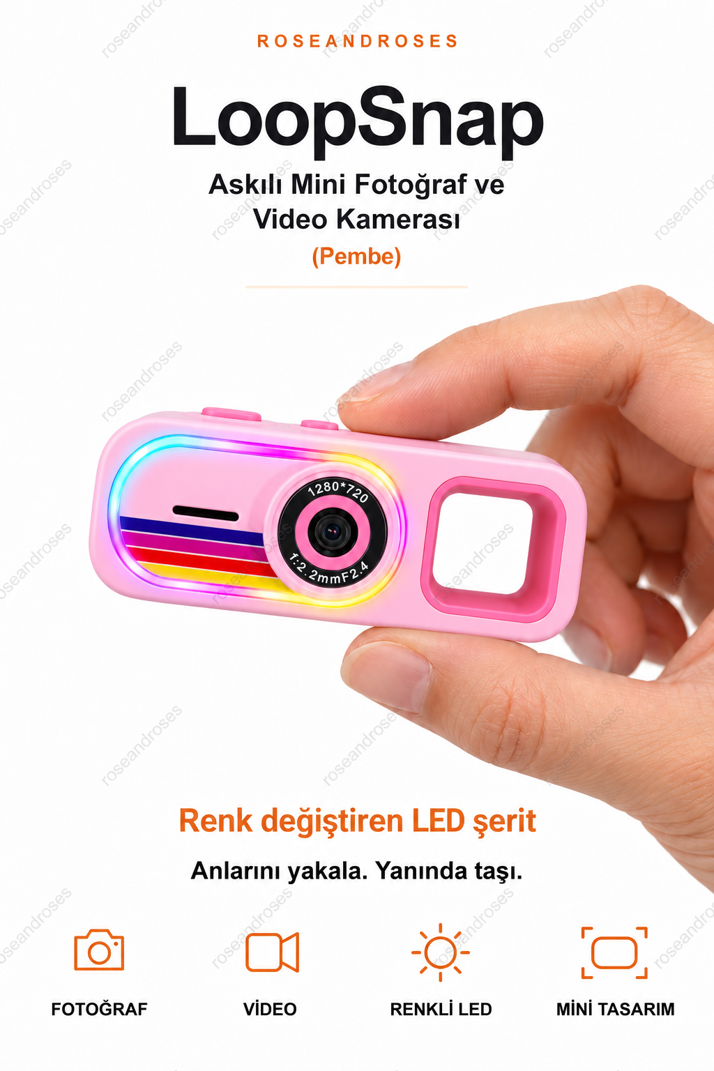 LoopSnap Pembe mini kamera — parmaklar arasında tutuş ve renk değiştiren LED şerit