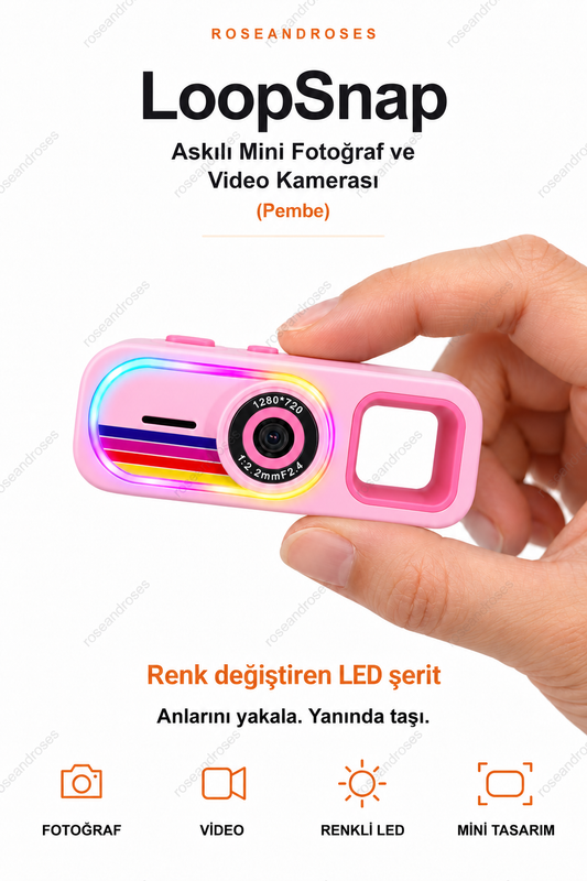 LoopSnap Pembe mini kamera — parmaklar arasında tutuş ve renk değiştiren LED şerit